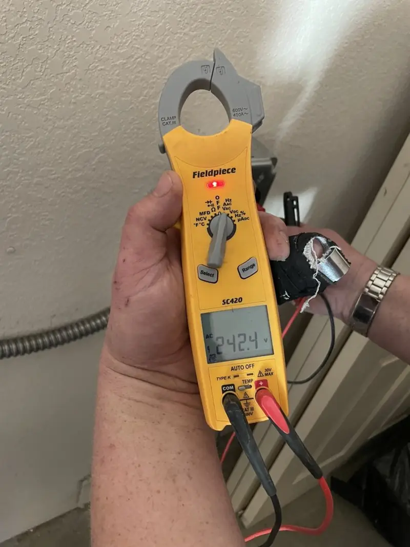Voltage testing with clamp meter during Outlet Installation in Chino